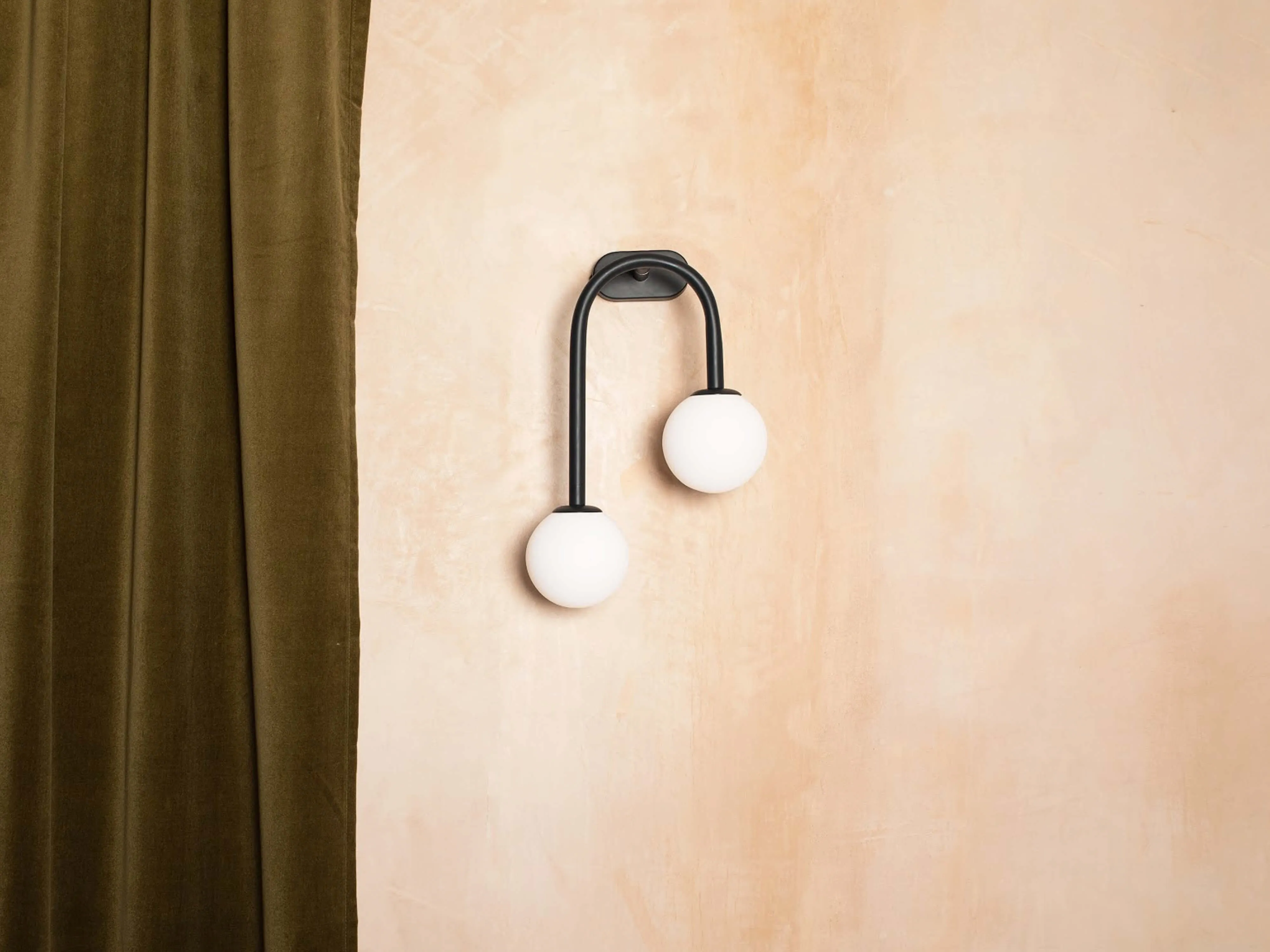 Brass drop curve wall light