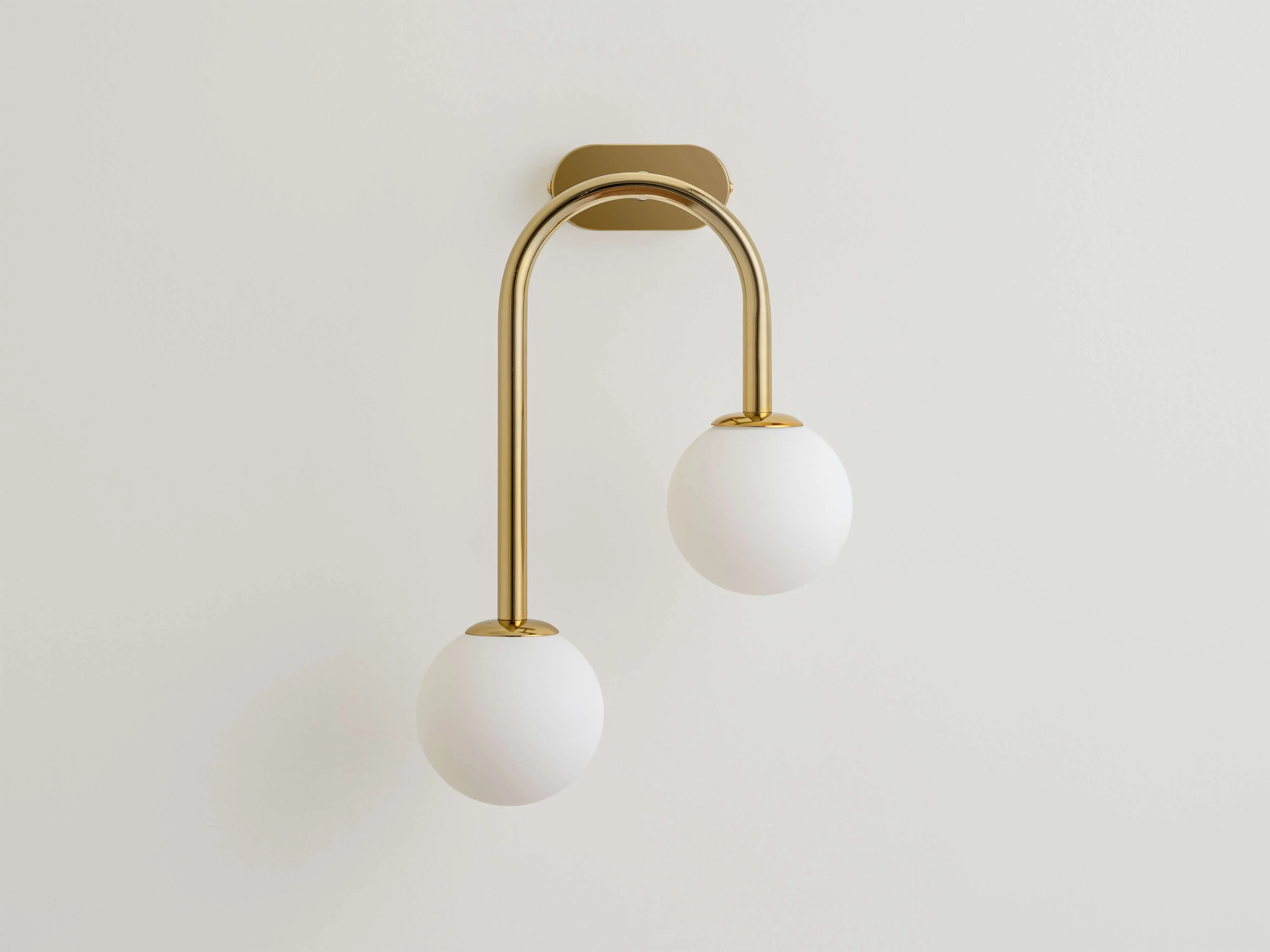 Brass drop curve wall light