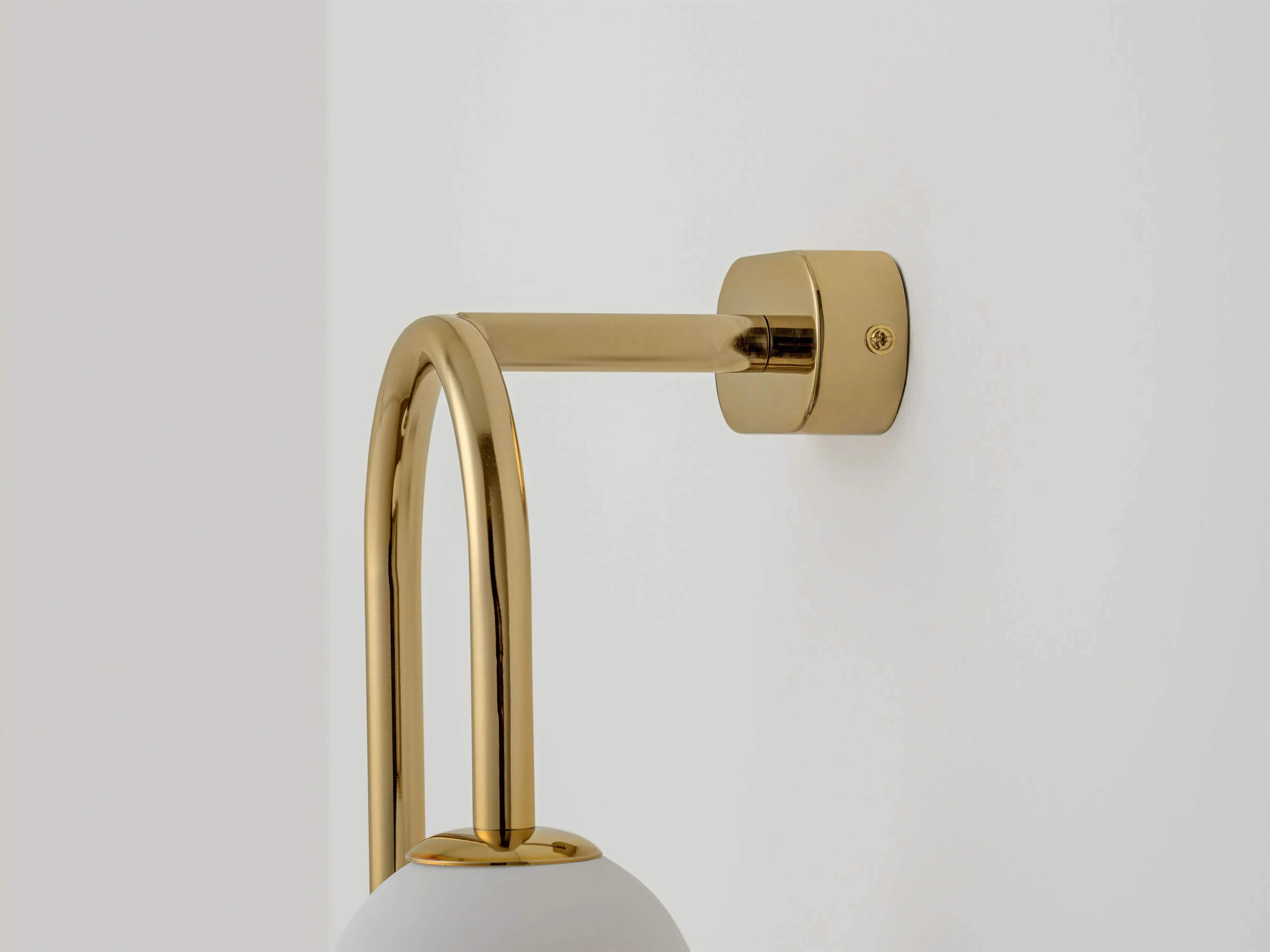 Brass drop curve wall light