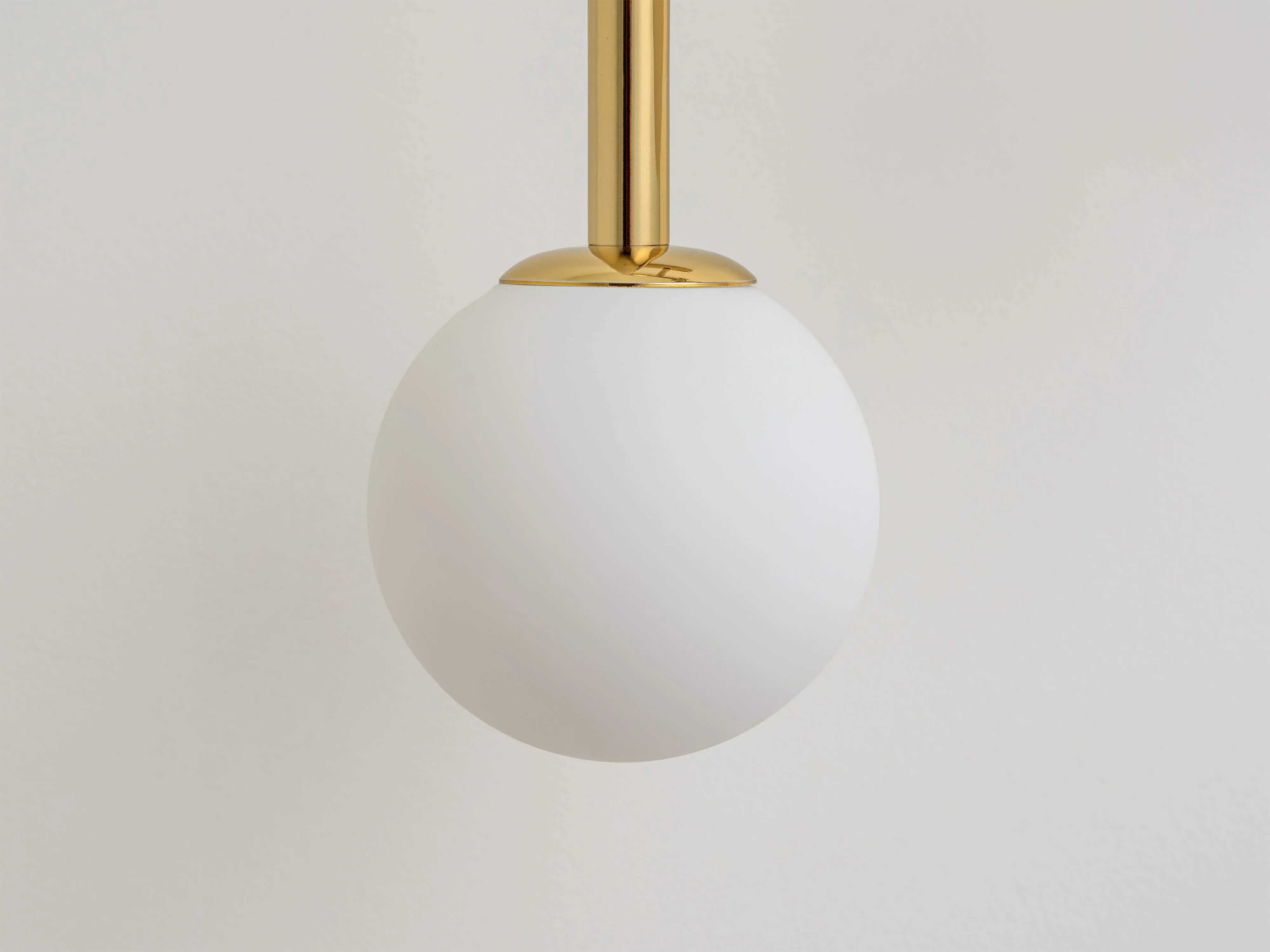 Brass drop curve wall light