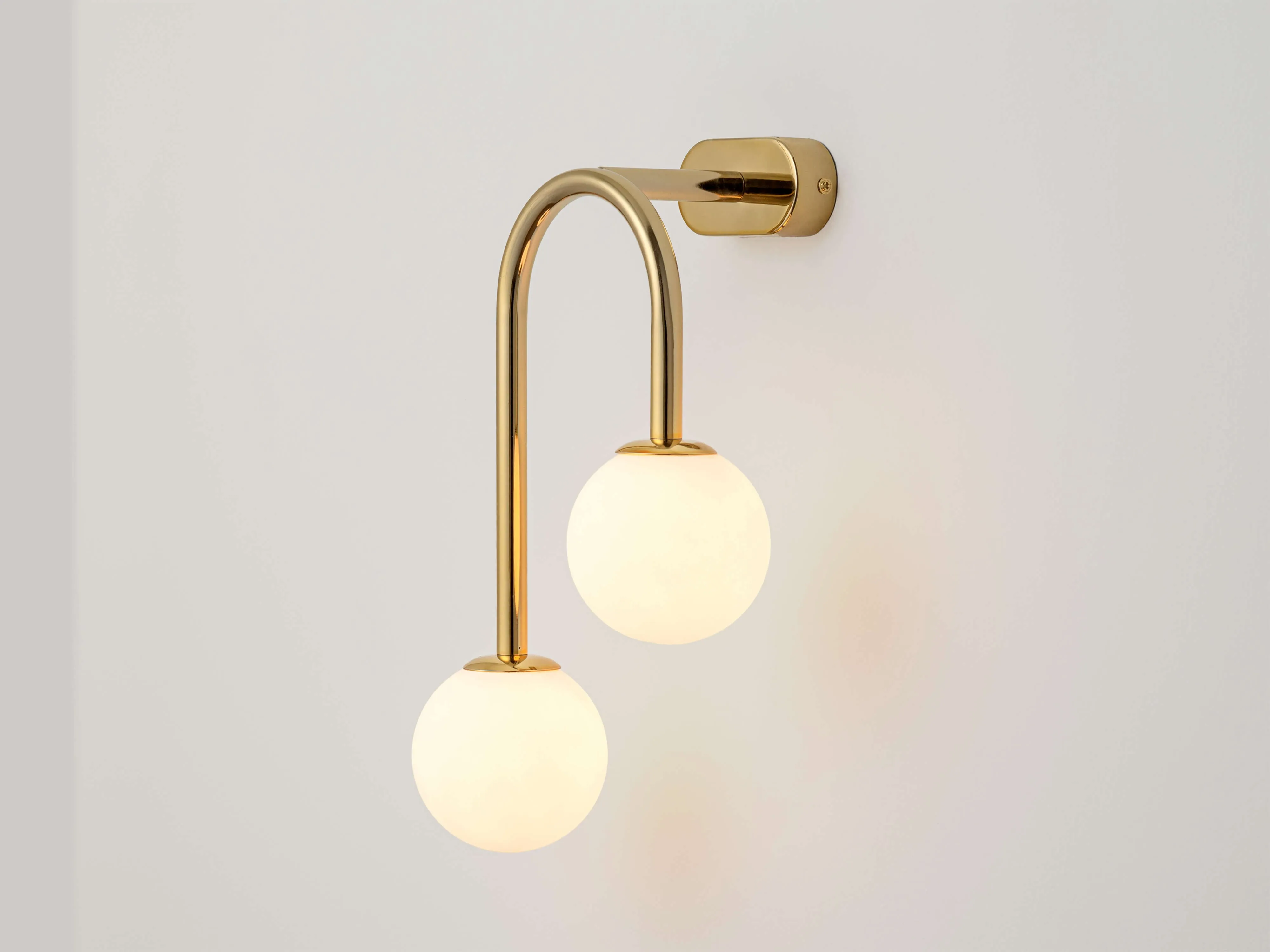 Brass drop curve wall light